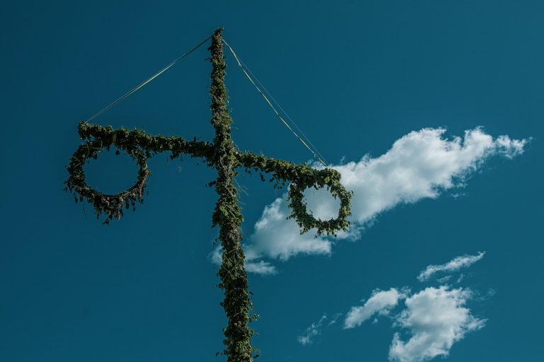green cross under blue sky